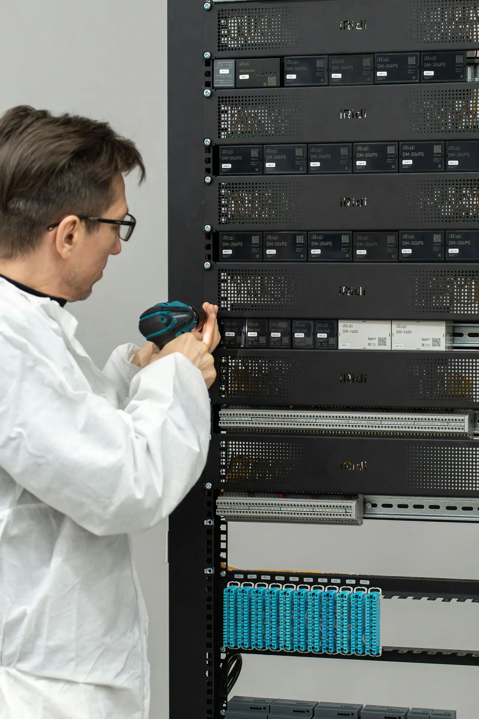Technician installing equipment in a server rack